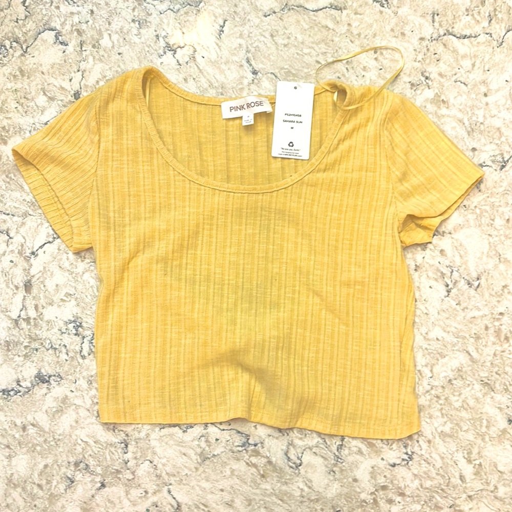 Dandelion yellow baby tee with open back.